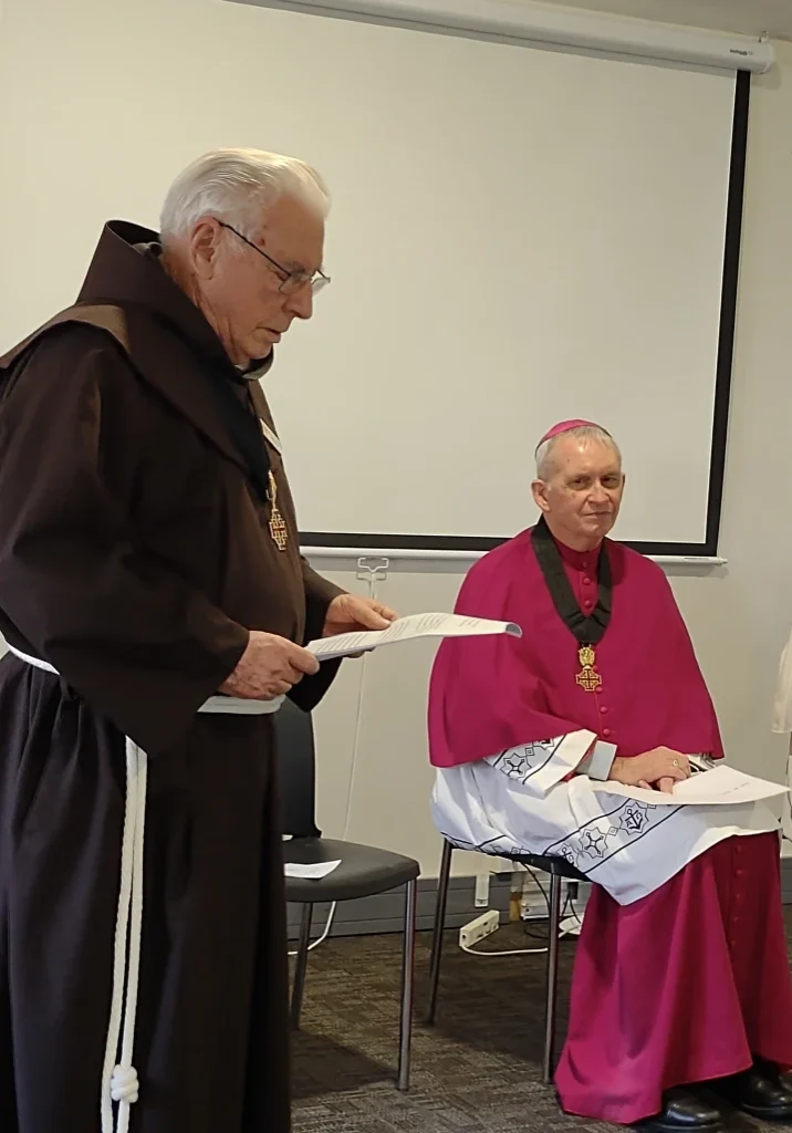 father-anthony-reading-the-citation-for-the-award-to-bishop-pat